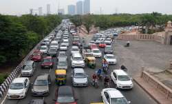 Vehicles on a busy Noida road.