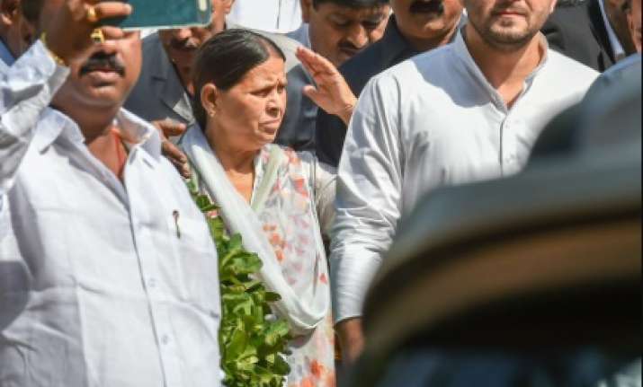 Former Bihar chief minister Rabri Devi with her son