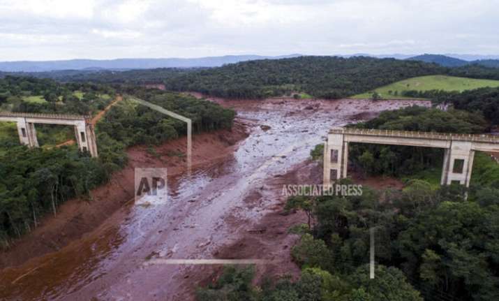 An aerial view shows a collapsed bridge caused by
