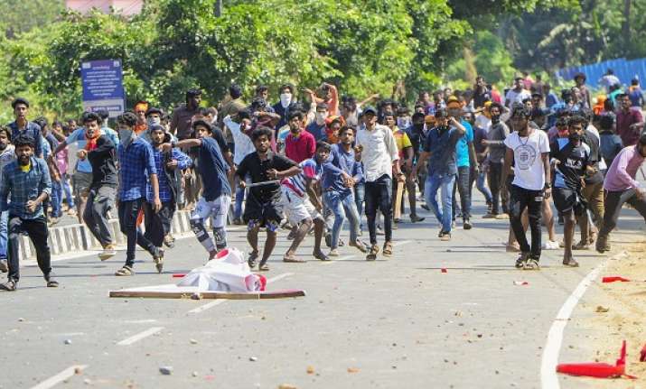 BJP workers hurls bricks and stones at the CPI office