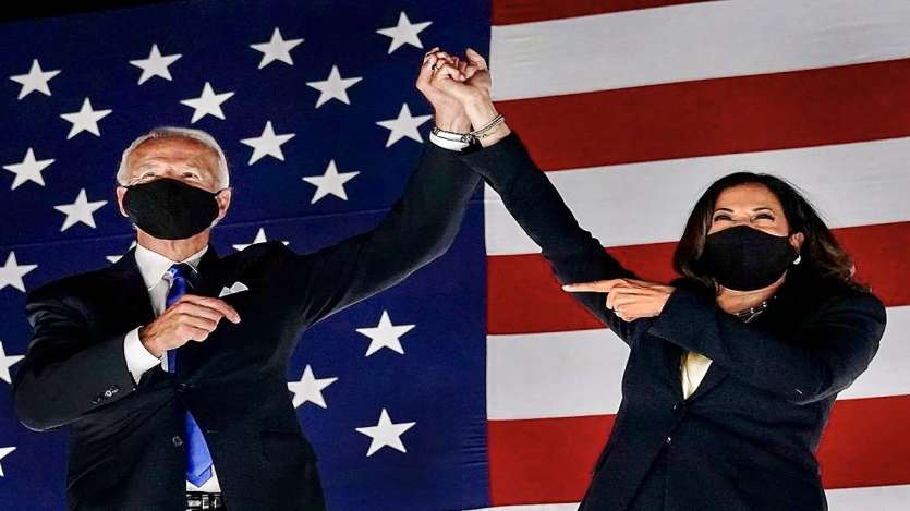 US President-elect Joe Biden and Vice President-elect Kamala Harris holds hands as they celebrate after winning the election.  