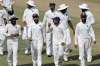 Indian players walk off the field after wrapping up the