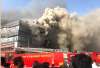 Smoke coming out from the Taxshila Complex after a fire