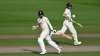 Chris Woakes and Jos Buttler of England run during Day Four