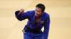 Naohisa Takato, of Japan, celebrates after defeating Yang
