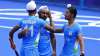 India's Mandeep Singh celebrates after India's Simranjeet Singh scores against Spain. 