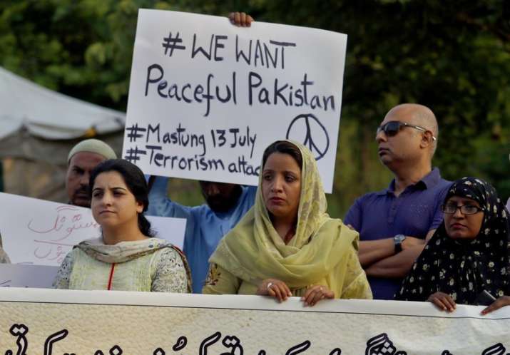 Members of a civil society hold a demonstration to condemn