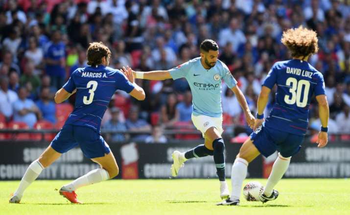 Riyad Mahrez (centre)