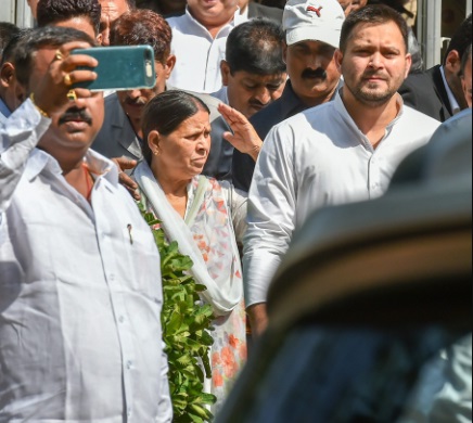 Former Bihar chief minister Rabri Devi with her son