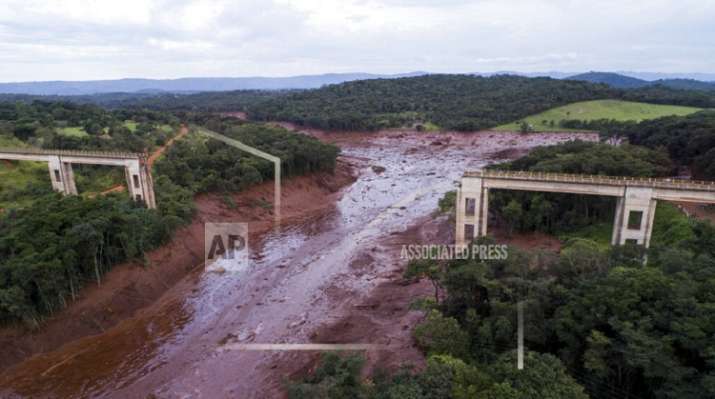 An aerial view shows a collapsed bridge caused by