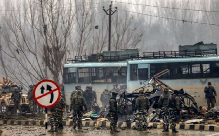 Security personnel carry out rescue and relief works at the