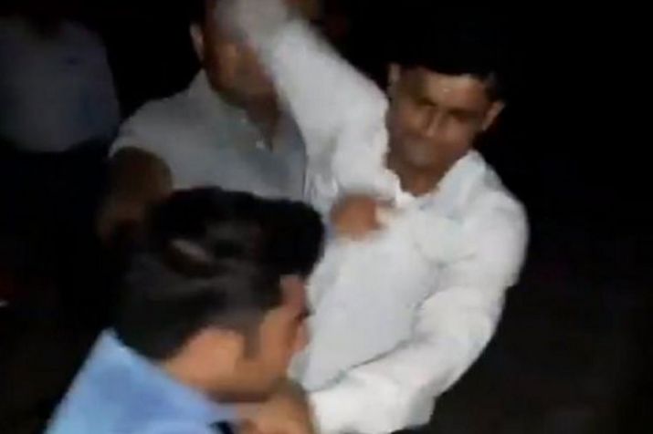 GRP Personnel beating up journalist Amit Sharma.
