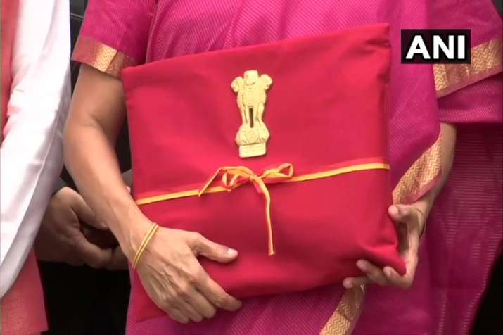 Posing for the shutterbugs with the Budget briefcase is a