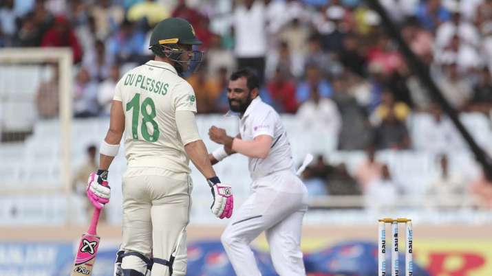 South Africa's captain Faf du Plessis, left, looks back