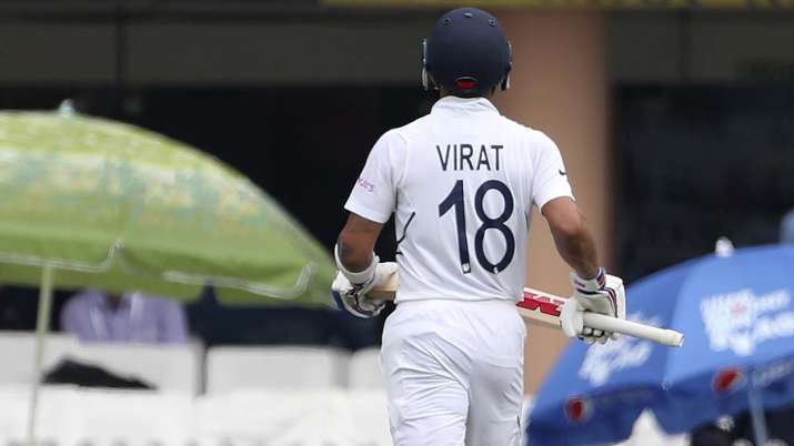 India's captain Virat Kohli leaves the field after being