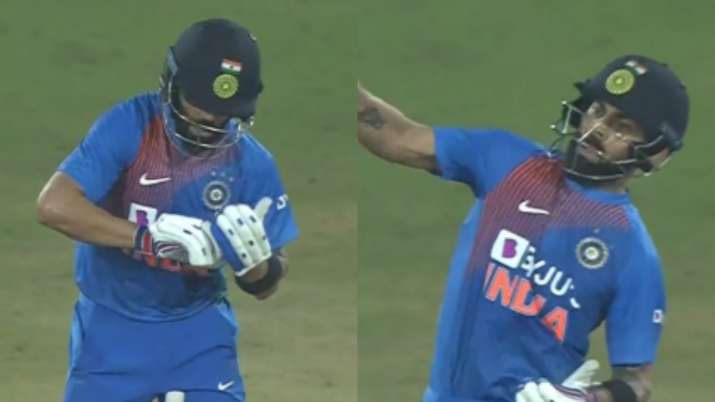 Kohli uses his bat as an imaginary notebook to "tick" the
