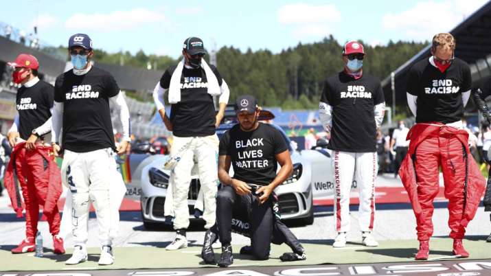 Mercedes driver Lewis Hamilton of Britain, centre, takes a