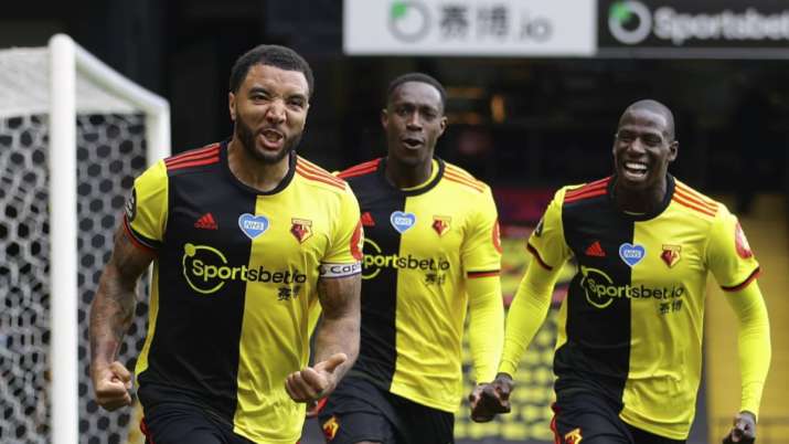 Watford's Troy Deeney, left, celebrates with teammates