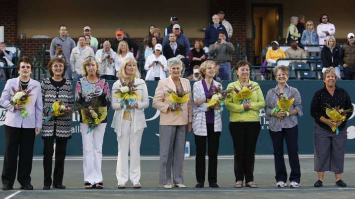 Members of the original nine women, from left to right,