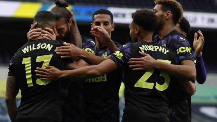 Newcastle's Callum Wilson, left, celebrates after scoring