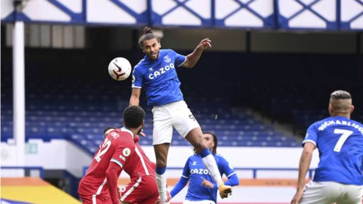 Everton's Dominic Calvert-Lewin, top, scores his side's