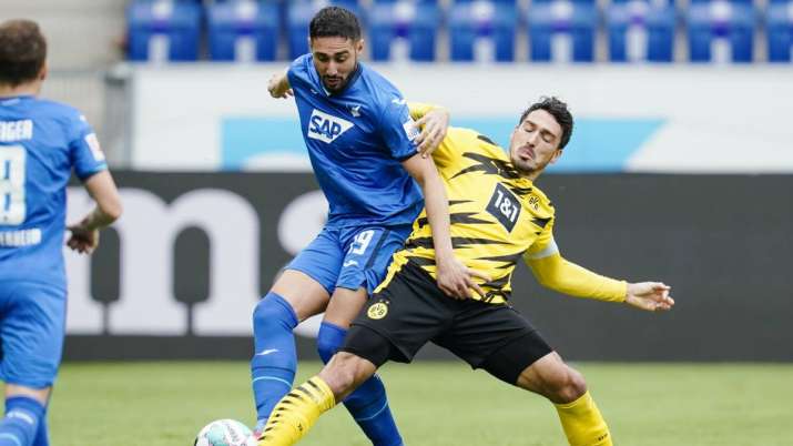 Hoffenheim's Ishak Belfodil, left, and Dortmund's Mats