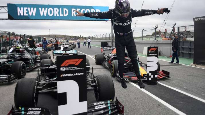 Mercedes driver Lewis Hamilton of Britain jumps out of his