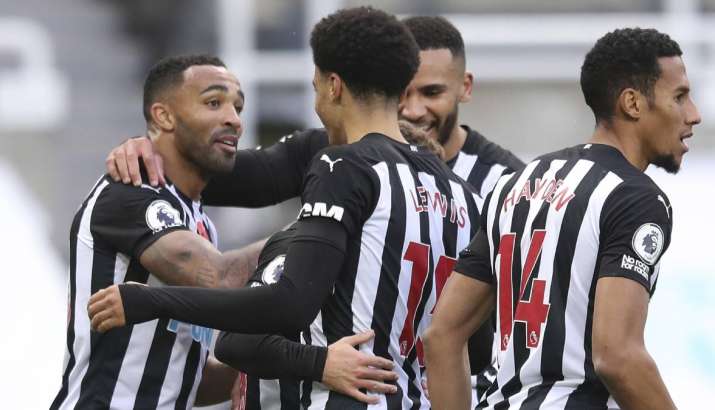 Newcastle's Callum Wilson, left celebrates with team mates