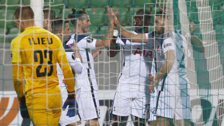 Tottenham's Harry Kane celebrates with teammates after