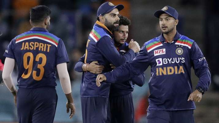 India's Virat Kohli, second left, celebrates with teammates