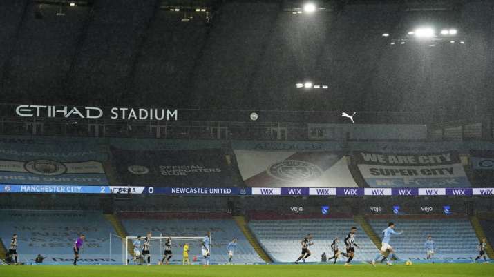 Players in the torrential rain during the English Premier