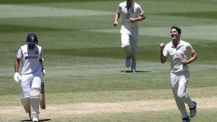 Australia's Pat Cummins, right, celebrates after taking the