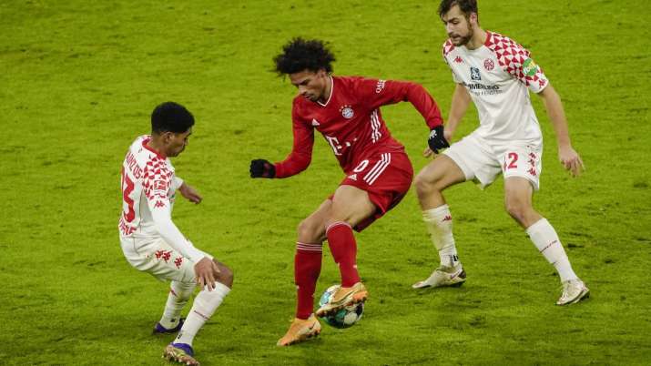 Bayern Munich's German forward Leroy Sane vies for the ball