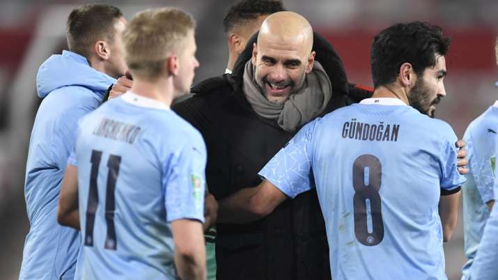 Manchester City's head coach Pep Guardiola, right,