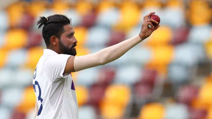 India's Mohammed Siraj gestures with the ball as he leaves