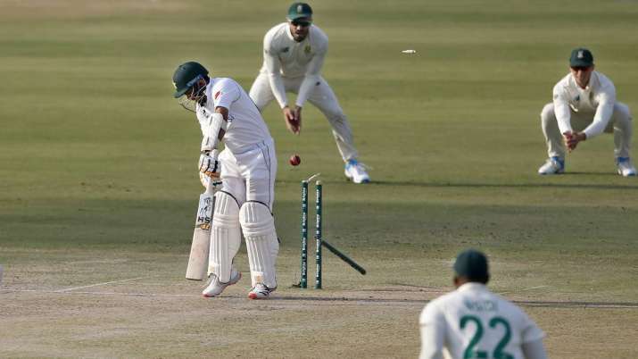 Pakistan's batsman Abid Ali, center, is bowled out by South
