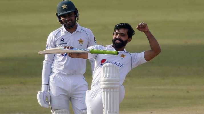Pakistan's Fawad Alam, right, celebrates after scoring