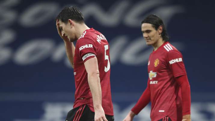 Manchester United's Harry Maguire, left, and Manchester