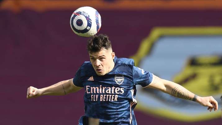 Arsenal's Granit Xhaka heads the ball during the English