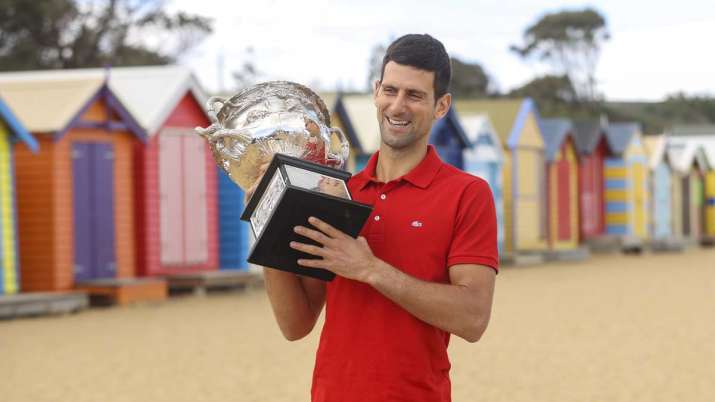 Serbia's Novak Djokovic poses for photos with the Norman