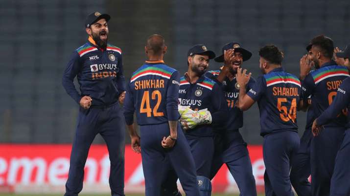 Virat Kohli of India (L) celebrates the wicket of Jos