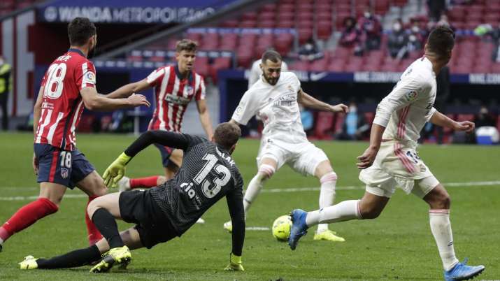 Real Madrid's Karim Benzema scores his side's opening goal