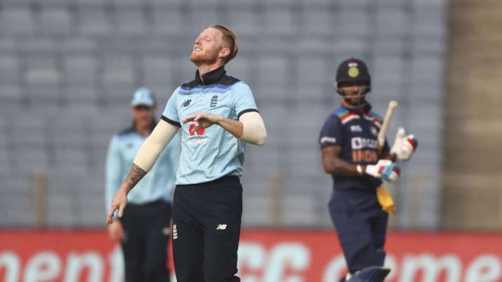England's Ben Stokes, front, celebrates the dismissal of