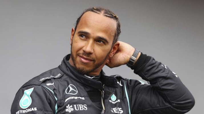 Mercedes driver Lewis Hamilton of Britain smiles after