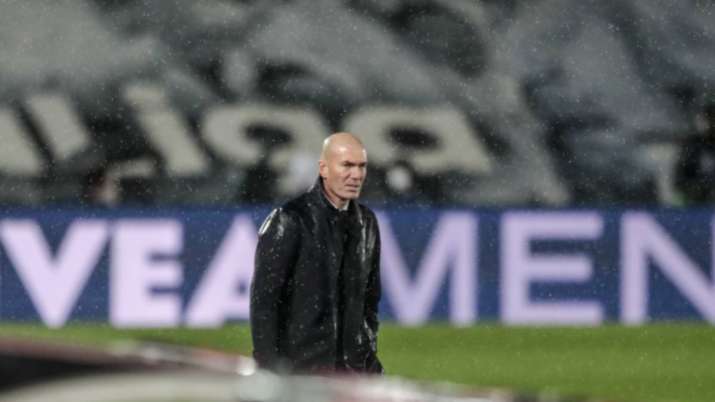 Real Madrid's head coach Zinedine Zidane looks on during