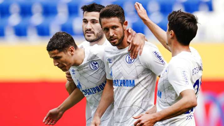 Schalke's scorer Mark Uth, second right, and his teammates celebrate a goal.
