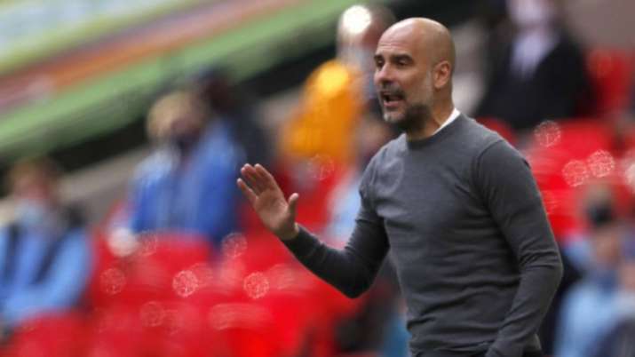 Manchester City's head coach Pep Guardiola gestures during