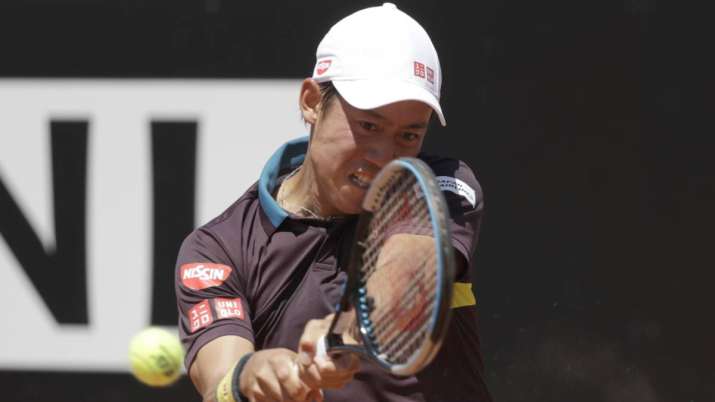 Japan's Kei Nishikori returns the ball to Italy's Fabio