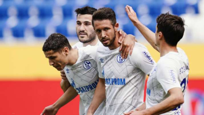 Schalke's scorer Mark Uth, second right, and his teammates