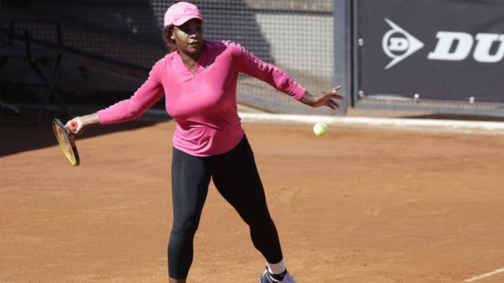 Serena Williams returns the ball during a training session